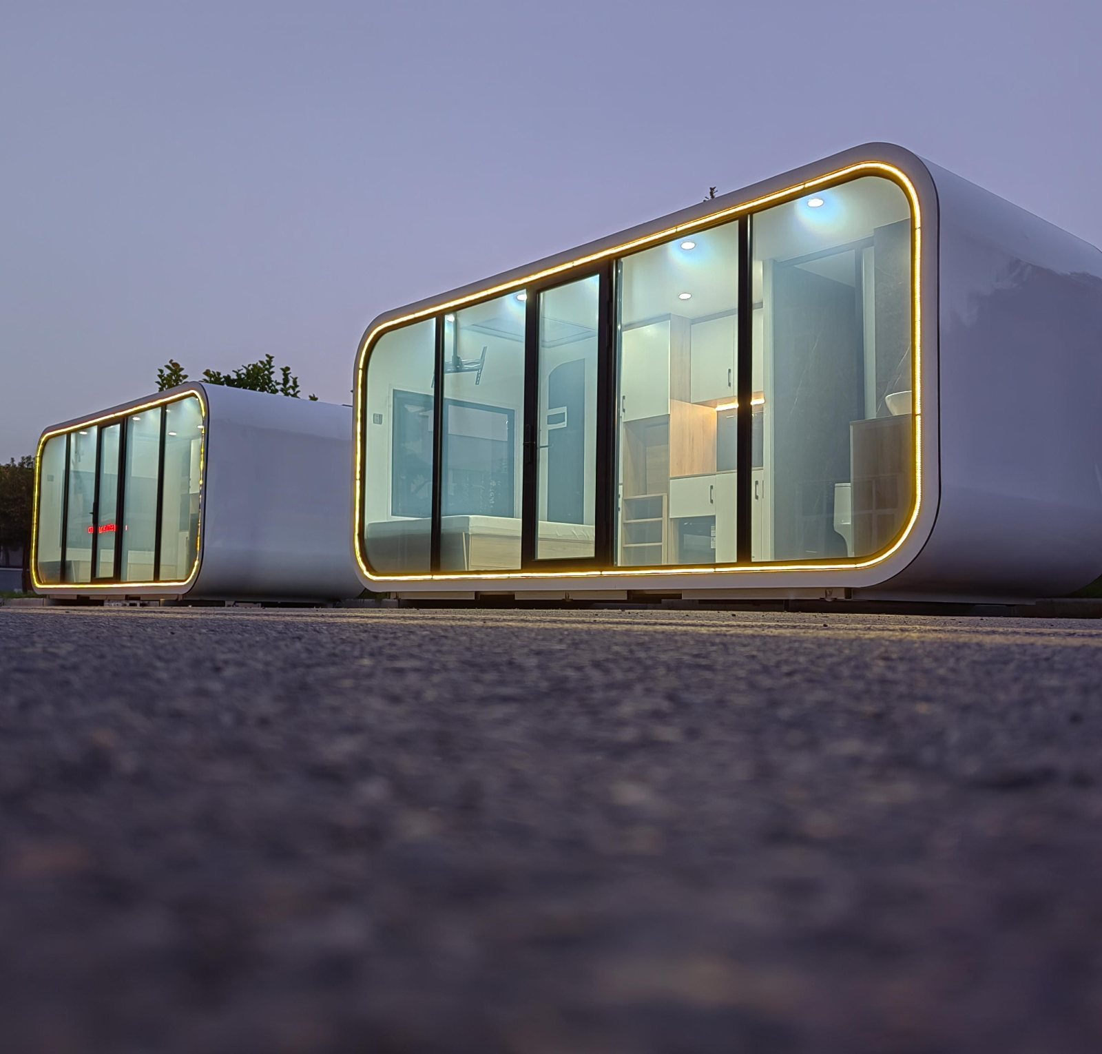 Home Pod at dusk with illuminated glass facade